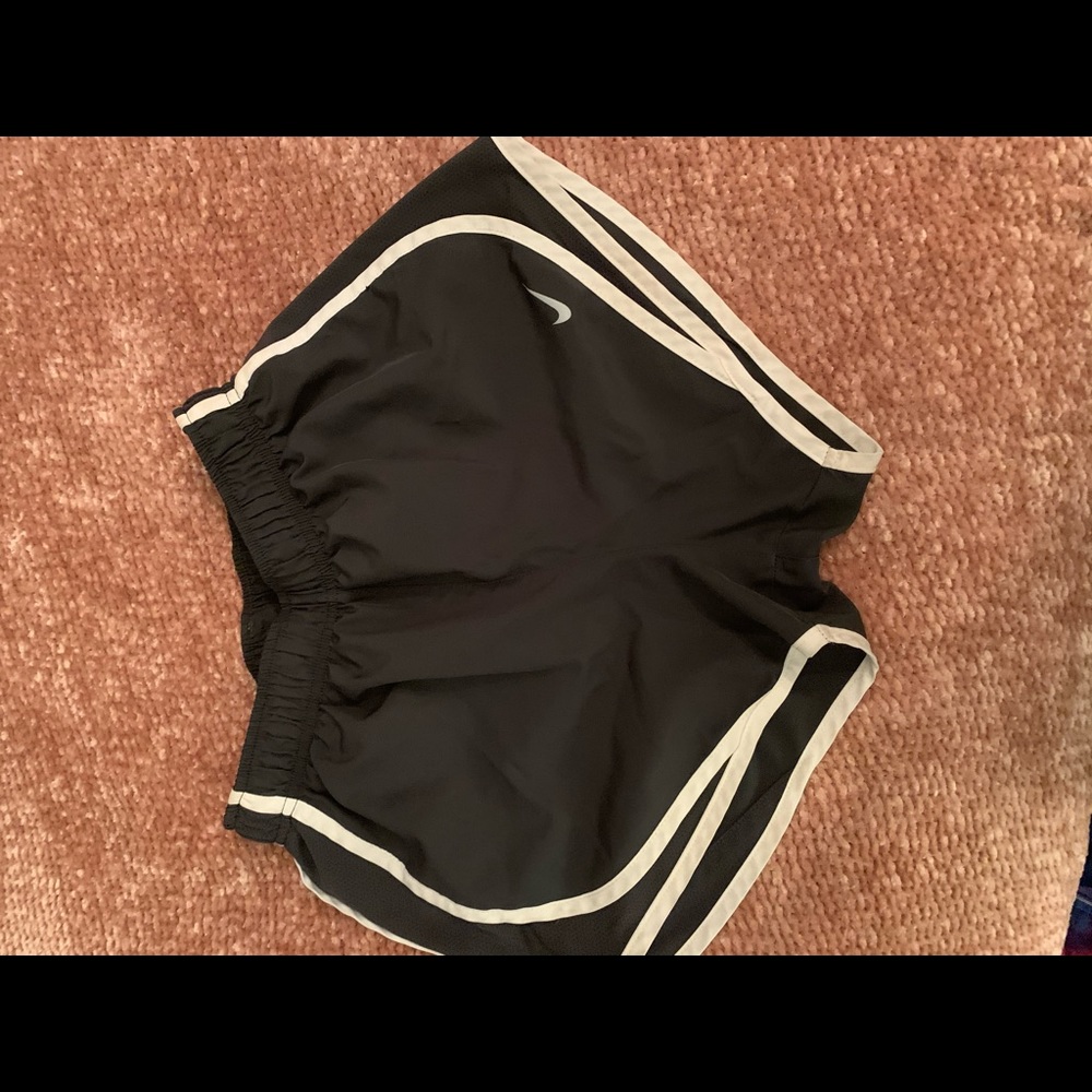 Women’s Nike Dri - Fit athletic shorts.